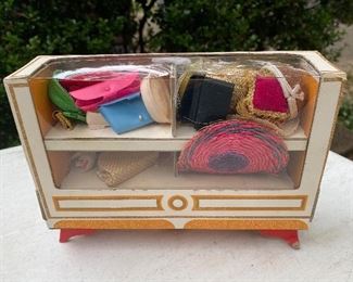 Vintage Barbie display dresser with accessories