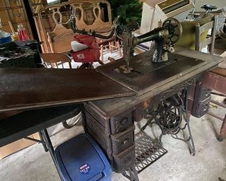 Singer treadle sewing machine with cabinet