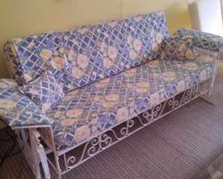 Vintage glider/ folds down to make a bed