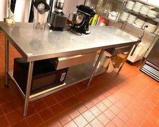 Stainless steel table with under shelf and drawers
96"x30"x36"
Includes built in Edlund can opener
Contents are not included