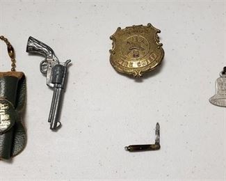 Collection of Vintage Items ~ Dr. Bells Tar Honey Cures Coughs Advertising Stick Pin, Junior Fire Chief Metal Badge by Tootsie Toy, Mini Pocketknife Charm and Six Flags over Texas Toy Pistol/Holster Keychain