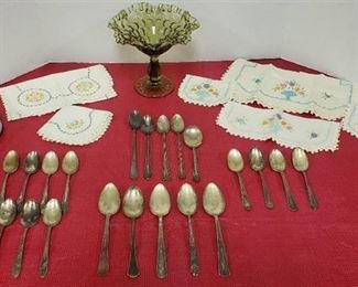 Various Silverplated Spoons, Table Linens, Floral Tin and Green Glass Compote