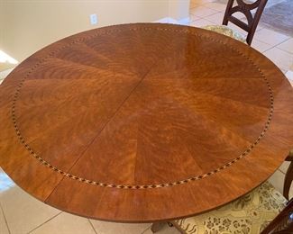 Round dining table with inlay