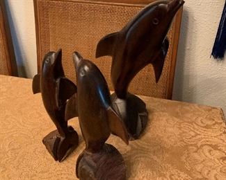 Carved wood dolphins