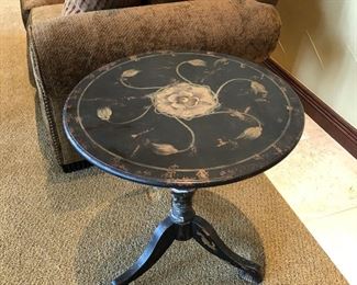 #75 ~ ($90) Pretty pedestal end table, hand painted in black with muted gold floral motif -**shows peeling to leg base, see photo of close up**
