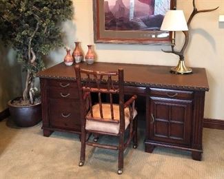 #14 ~($350)  Mahogany desk with leather top held down with brass studs on sides. See photo of slight Sun fading to leather. - Measures 68"W x 17"deep x 36"H.  