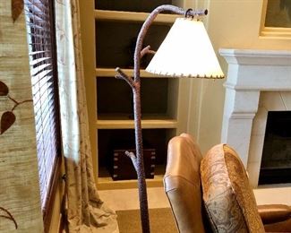 #81 ~ ($300) Heavy wrought Iron  Floor Lamp with Cowhide shade.  Iron base resembles a  tree branch with acorns- 66" H. Pictures don't do it justice.