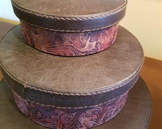 #13 ~($20) Set of three stacking boxes with embossed leather sides and leather lids. Largest is 11" diameter