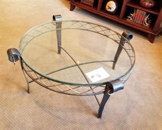 #16 ~ ($200)  Glass top coffee table with iron frame and legs, brass accents.- 41" diameter x 18"H-  Matching end table is # 3! 