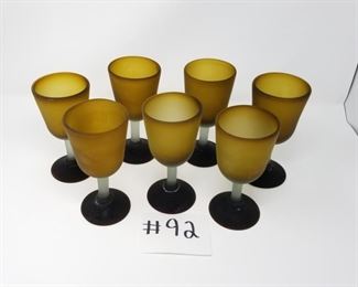 #92 ~ ($25/set)  Thick hand blown amber color glass goblets from Mexico, each one different.  Matte finish.  Darker brown base.  Set of 7