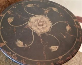 #75 ~ Top view of Pretty pedestal end table, hand painted in black with muted gold floral motif ($90)
