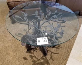#78 ~ ($350)  Glass top table with iron hand made base of trees and elks- 34 " diam - 19.5 " H- Can be used as a small coffee table or an end table