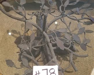 #78 ~ ($350) Close up of trees on iron base of Glass top table 