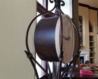 #101 ($500) Impressive Howard Miller Wrought iron and stone clock.  Chimes, with pendulum.  7ft tall.  Very heavy.