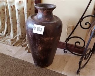 #102 ($100) Large HEAVY stone? Urn,  measures 31" tall x 16" wide.  Brown tones.