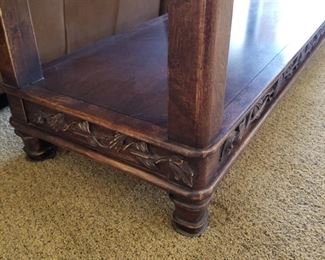 #103 ($200) Large rustic Sofa table in dark ornate wood with fun leaf handles.  Lots of carving.  5ft wide x 20"D x 31"H.