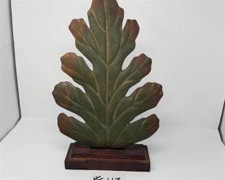 #113 ($25) painted metal leaf on wood stand. NWT. 20" tall.