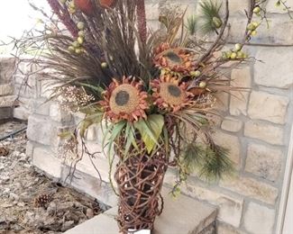 #138 ~($25)  A tall heavy vase surrounded by wrapped twigs.  Full of dried fall foliage. Measures 42" tall including foliage. 