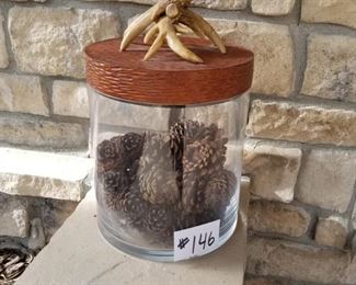 #146 ~($30)  Large glass jar with heavy resin lid with elk horns.  Filled with pine cones.  Remove lid and fill with our own decor!  Larger than appears in photo.  10" diam x 15" tall including lid.  