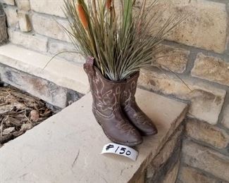 #150  ~($12)  cute resin painted cowboy boots filled with dried cat tails.  Boots are 9" tall. One boot has small hole