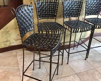 #123 ($100 each) unique bar stools  with 30" seat height.  Real leather straps make up the seat and back.  On a metal frame.