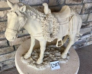 C-507 ~ ($25)  Stone-like horse , resin, stands 22" tall x 19"W. (Xmas theme)