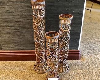 #200 ($30) set of candlestick holders, metal scrolls. 25", 21" & 17".  Set of three