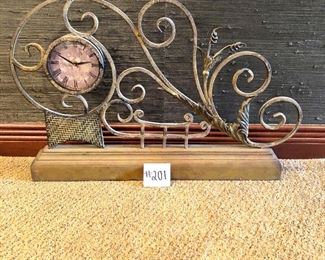 #201 ($60) large mantel or tabletop clock made of metal.  Battery operated. 20"H x 29"W x 4"D