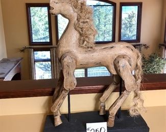 #250 ($50) large carousel horse (table top) on wood base. Painted wood, the legs move.  21"H x 16"W x 6"D