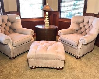#255 ($250) Set of 2 club chairs and one ottoman.  Genuine suede leather in a rich beige tone.  Needs spot cleaning.  Chairs measure 38"W x 40"D x 38"tall.  Ottoman 30" x 33" x 18"H.  Brass studded accents.  Very well made chairs.