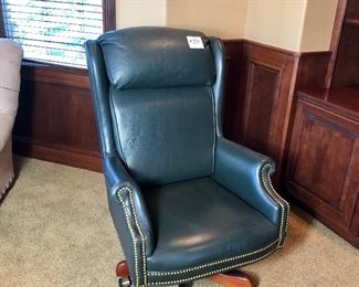 #254 ($50)  Green leather executive chair, leans back and swivels * has a couple studs missing and light scratches to the back 