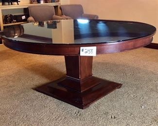 #258 ($250) Large solid cherry pedestal table measures 66" diameter 30"H.  Very good condition! Comes with protective glass top. (removable).  Chairs not included.