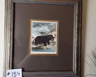#154 ($15)~ Cute wall art, hippo by a stream 17" x 18".  matted and framed. 