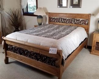 #158 ~($500) Gorgeous queen pine bed frame with mattress  and box spring.  The scroll work is wrought iron leaves and vines. Great condition!