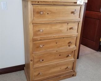 #163 ~($75) Pine chest of drawers, good condition, comes with a protective glass top.  Measures 33"W x 18"D x 50"H.