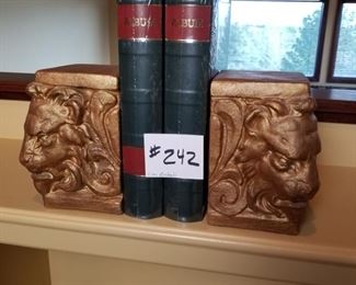 #242 ($20)  Gilded lion bookends. Heavy. 8" tall.