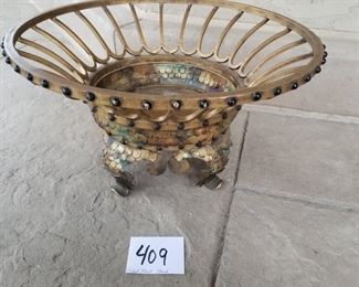 #409 ($20) gilded brass plant stand on legs.  Holds a 7.5" pot or smaller.  Measures 18" diameter x 7.5" tall.