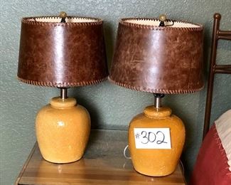 #302~ ($40) Set of two table lamps- Ceramic base with brown leather shade- 22" tall