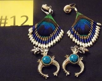 #12 Peacock feather earrings 2.5 long clip on. Silver with turquoise stone 2 inches long.  $10 each go to Tas-Estate-Sales.com to purchase.