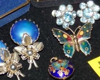 #4 One set of blue and silver clip on earrings, Set of baby blue crystal screw on earring, butterfly pin, and butterfly necklace charm.  $5 each go to Tas-Estate-Sales.com to purchase.