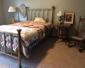 Brass bed with linens
