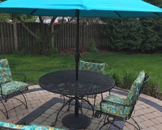 $285.00 original Woodard table, 4 painted Woodard style chairs, cushions, Umbrella & Stand