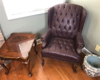 Tufted Burgundy Wing back chair with nail-head trim , Queen anne wood side table  planter vase
