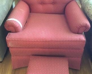 Upholstered chair with small stool