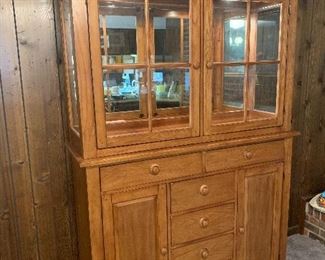 v105- beautiful hutch- lights up, drawers are lined, and it comes apart in two pieces. Solid wood $400 