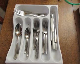 Mixed set silverware-Includes: 14 forks, 8 table knives, 6 large serving spoons, 5 Ice tea spoons, 1 butter knife, Carving fork, 4 teaspoons-Price 15.00