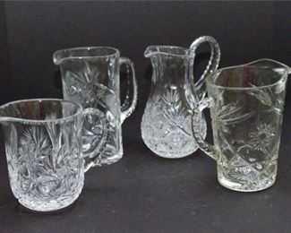 225. Four 4 Cut Crystal Pitchers