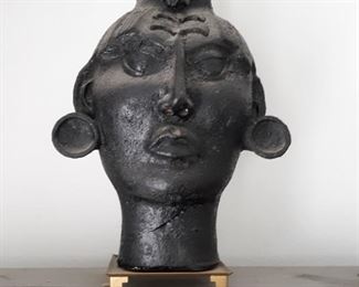 Large ethnic memorial head on brass stand