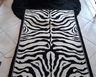 Porcelain Zebra and 2 area rugs