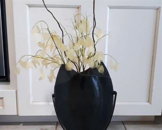 Thin vase with decorative plant